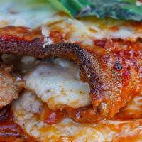 Eggplant Rollatini · Fried eggplant stuffed with ricotta, topped with sauce and side of bread.