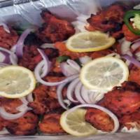 Chicken Tikka - Tandoori · Special grilled chicken dry normal spices and comes with salad and yoghurt sauce.