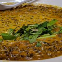 Savory Lentils Cooked To Perfection · Lentil cooked with onion and tomato sauce with spices.