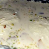 Rasmalai · Made with cheese and milk.