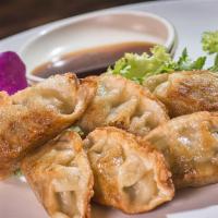 Gyoza · Pan-fried or steamed pork dumplings.