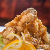 New Rocky Shrimp · Lightly battered deep fried shrimp with special sauce on lettuce.