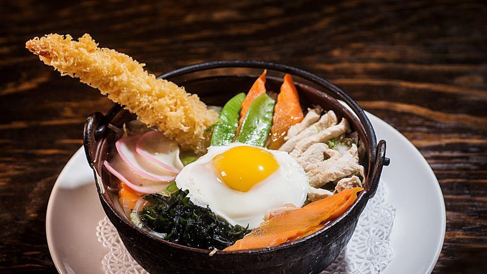 Nabeyaki Udon · Noodles with Shrimp, fishcake, chicken, vegetables and egg in stew style.
