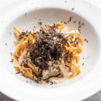 Tagliatelle Tartufo Nero · Home-made egg pasta and black truffle.