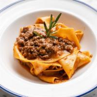 Pappardelle Al Ragu' · Slow cooked beef ragu bolognese style.