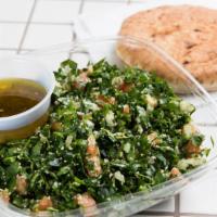 Tabbouleh Salad With Pita Bread · Vegetarian. Fresh parsley, wheat bulgur, fresh tomatoes, onions, fresh lemon juice and olive...