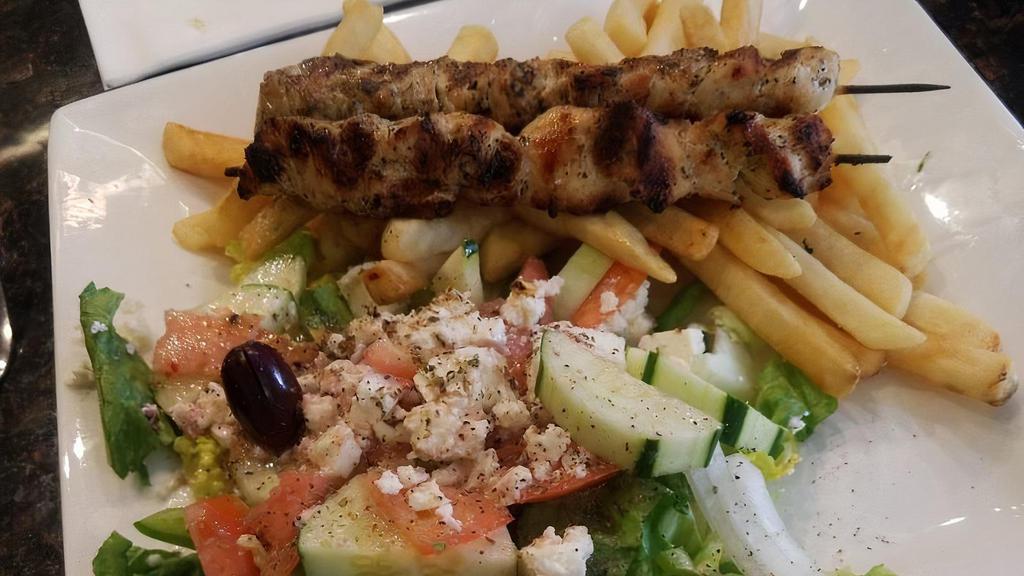 Chicken Souvlaki Platter · Served with french fries, Greek salad, and pita bread.