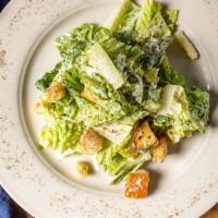 Classic Caesar Salad · Green salad with caesar dressing and cheese.