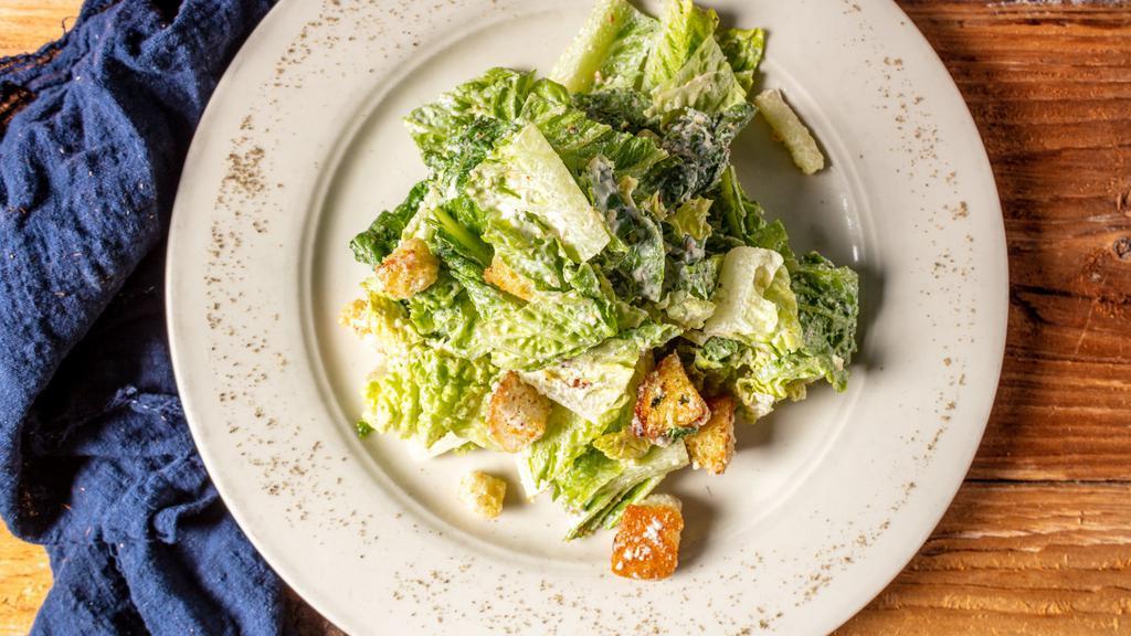 Classic Caesar Salad · Green salad with caesar dressing and cheese.