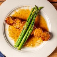Bacon Wrapped Sea Scallops · With grilled broccoli, rice pilaf, and lemon butter.