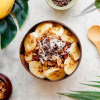 Nutty Cacao Bowl · Acai bowl topped with  granola, bananas, cacao nibs, peanut butter, and almond slices.