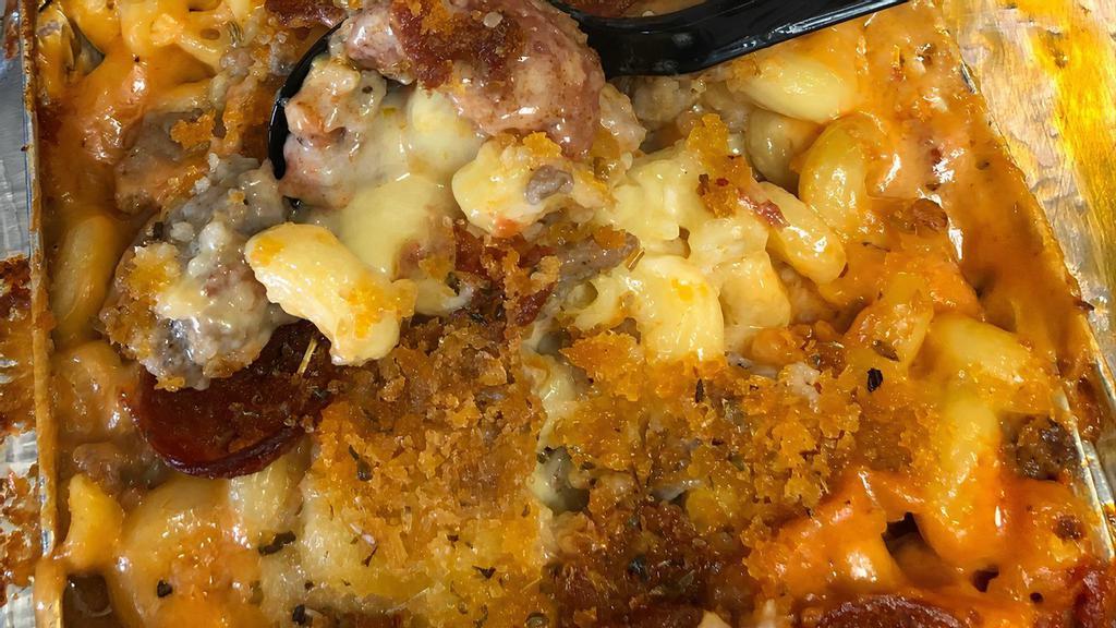 Sicilian Pizza Mac And Cheese · Holy Grail of Mac and Cheese! Loaded with sweet Italian Sausage, Pepperoni, Parm, Romano, Asiago Cheeses, and homemade sauce! Topped with Buttery Bread Crumbs!
