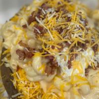 Groovy Ruby · Huge baked potato loaded with butter, cheese, MAC & CHEESE, sour cream, bacon! Ultimate carb...