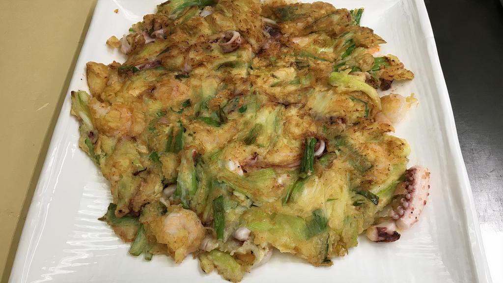 Haemul Pajun(해물파전) · Seafood pancake.