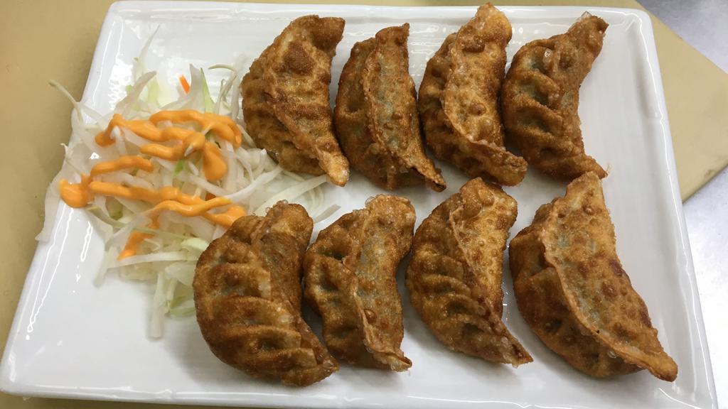 Gun Mandu (8)(군만두) · Deep-fried beef dumplings.