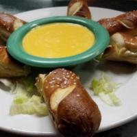 Pretzels · 2 soft pretzels served with cheese sauce.