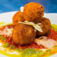 Mac & Cheese Balls · Our homemade mac and cheese balls, made with cheddar cheese and jalapenos served with our ho...