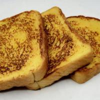 Original French Toast · Thick cut french toast smothered in egg batter with vanilla and cinnamon. Served with warm s...