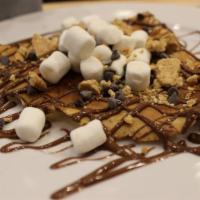 S'Mores Crepe · Marshmallow, chocolate chip, nilla waffle crumb with Nutella and whip cream.