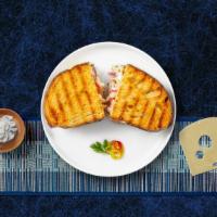 Tune In Tuna Panini · Tuna with your choice of cheese served tuna melt style on pressed European flat bread.