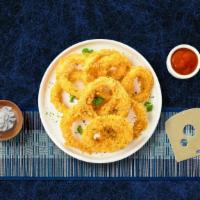 Onion Rings · Sliced onions dipped in a light batter and fried until crispy and golden brown. Served with ...