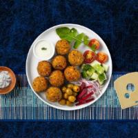Falafel · (Four pieces) Baked and fried mixture of garbanzo beans, fava beans, coriander, cumin, parsl...