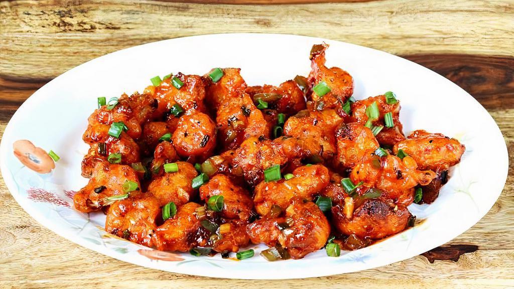 Gobi Manchurian (Gf,V) · Popular Indian Chinese dish. The cauliflower has a crispy coating and is tossed with a mouth-watering spicy sauce.