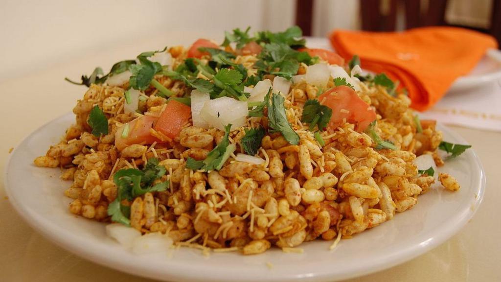 Bombay Bhelpuri (Gluten-Free, Vegan) · One of the most popular street foods in India. Delicious mixture of puffed rice, sev, tomato, potato, onion and sweet-sour-spicy chutneys.