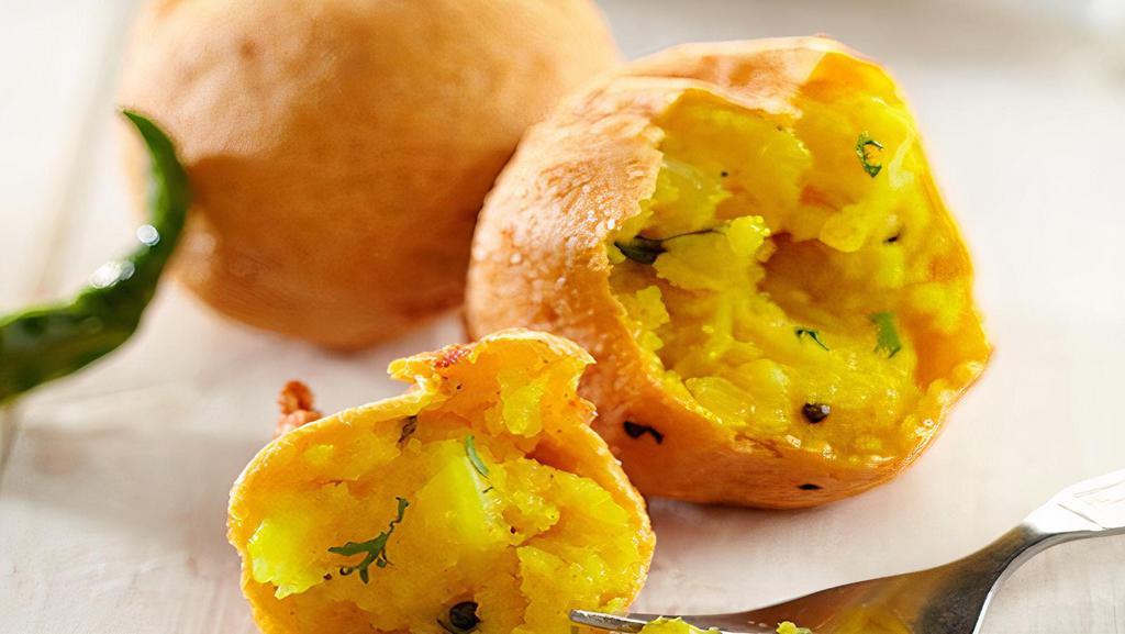 Batata Vada (Gf,V) 2 Pc · Spicy. Popular Indian vegetarian fast food, also known as aloo bonda, deep fried savory appetizer made with spicy potato mix.