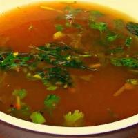 Rasam  (Gf,V) 16 Oz · Spicy lentil tamarind soup tempered with curry leaves.