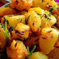 Jeera Aloo  (Gf,V) · Mildly spiced dish made of boiled potatoes, tomatoes, cumin, fenugreek leaves and Indian spi...