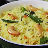 Lemon Rice (Has Nuts) · Lemon flavored rice served with sambar & papadum.