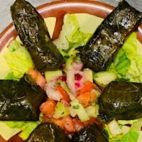 Stuffed Grape Leaves · Vegetarian. Grape leaves stuffed with tantalizing mix of rice, fresh parsley and plum tomato.