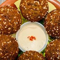 Falafel Sandwich · Vegetarian. The famous Middle Eastern Falafel, homemade and served with tahini sauce, tomato...