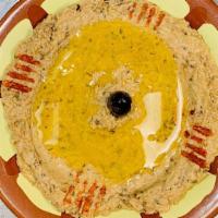Baba Ganoush · Vegetarian. Smoky flavor of eggplant mixed with tahini and garlic. Topped with olive oil and...