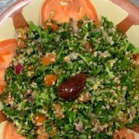 Tabouleh · Vegetarian. Refreshing salad made of finely chopped parsley, tomatoes, mint, onion and bulgu...
