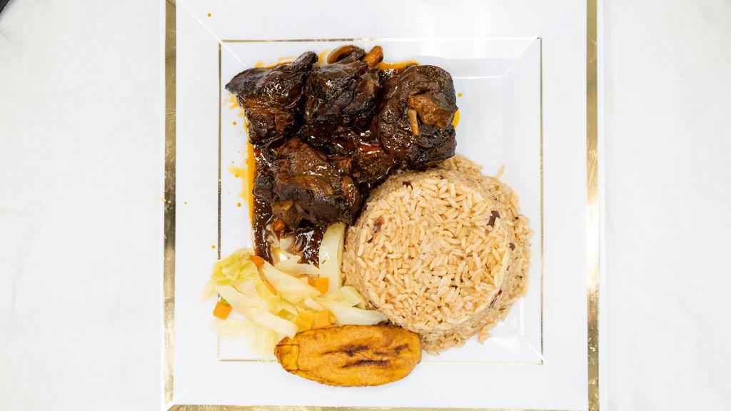 Stewed Chicken Lunch Special · Served with rice and peas or white rice, steamed vegetables and iced tea or lemonade.