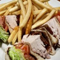 Turkey Club · bacon, lettuce & tomato. served with french fries, pickle & coleslaw