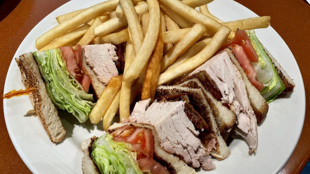Turkey Club · bacon, lettuce & tomato. served with french fries, pickle & coleslaw