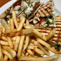 Italiano Panini · grilled chicken, roasted peppers, fresh mozzarella & pesto on thin panini.. served with fries