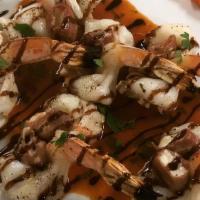 Shrimp Scavello'S · Shrimp stuffed with fresh mozzarella wrapped with prosciutto infused with red wine and toppe...