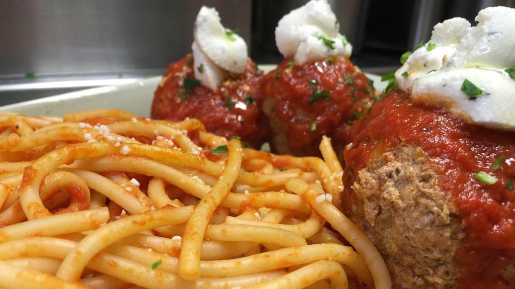 Classico Spaghetti & Meatballs · Hand rolled meatballs with bucatini, ricotta, basil, san marzano tomato sauce.