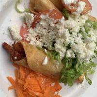 Flautas De Pollo · Three crispy fried  tortillas stuffed with chicken. Topped with fresh lettuce, tomato, queso...