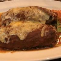 Poblano Del Monte · Two poblano peppers stuffed with fresh vegetables topped with meltedcheese and roasted tomat...