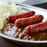 Sausage Curry · 3 premium Kurobuta pork sausages with Japanese curry and shredded cabbage over rice. Curry s...