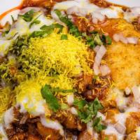 Samosa Chaat · A famous Indian street food that starts with 2 Veg Samosa's (fried pastry with seasoned pota...