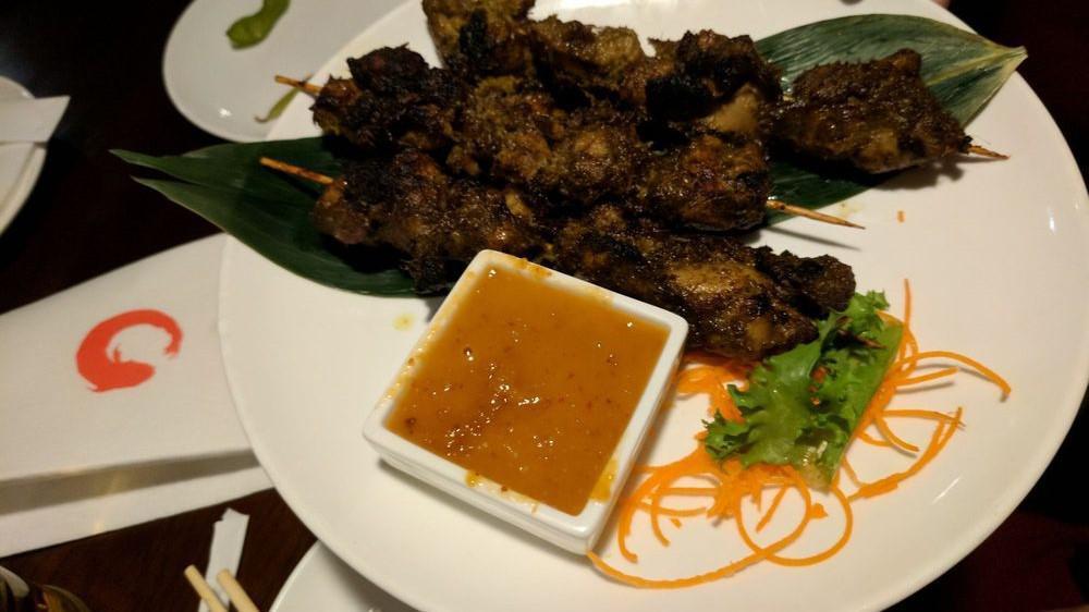 Chicken Satay · 3 pcs grilled with Thai peanut sauce.