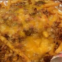 Sloppy Fries · French fries covered in chili, topped with cheddar-jack cheese, scallions and sour cream.
