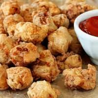 Chicken Bites (10 Pc) · chicken bites its marinated with spices and serve with white sauce and ketchup.