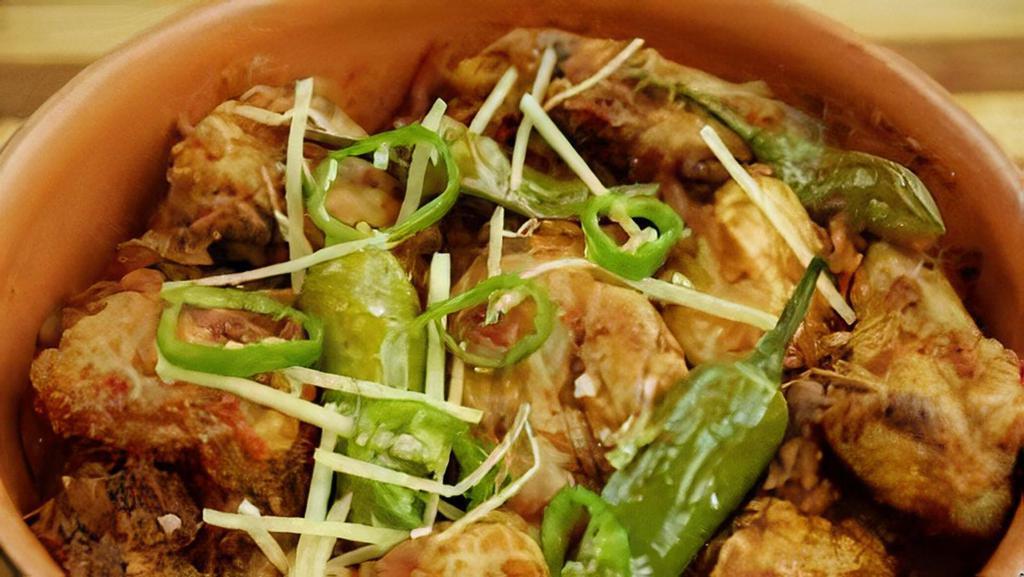 Afghan Chicken Karahi · (Half Chicken small peaces) cook with small pieces in tomato ginger, garlic, with mild spices with butter topping serve with pita naan. side salad , sauce...